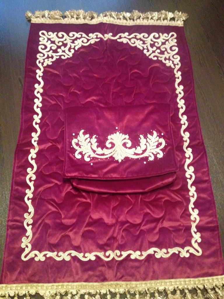 Embroidered prayer rug
