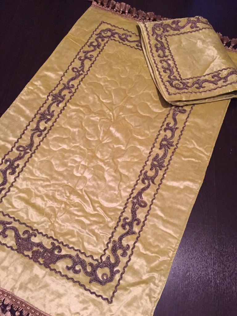 Embroidered prayer rug