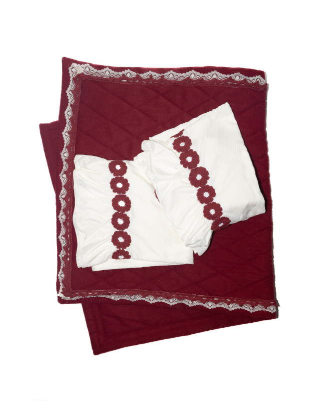 Dark red prayer mat with a prayer set